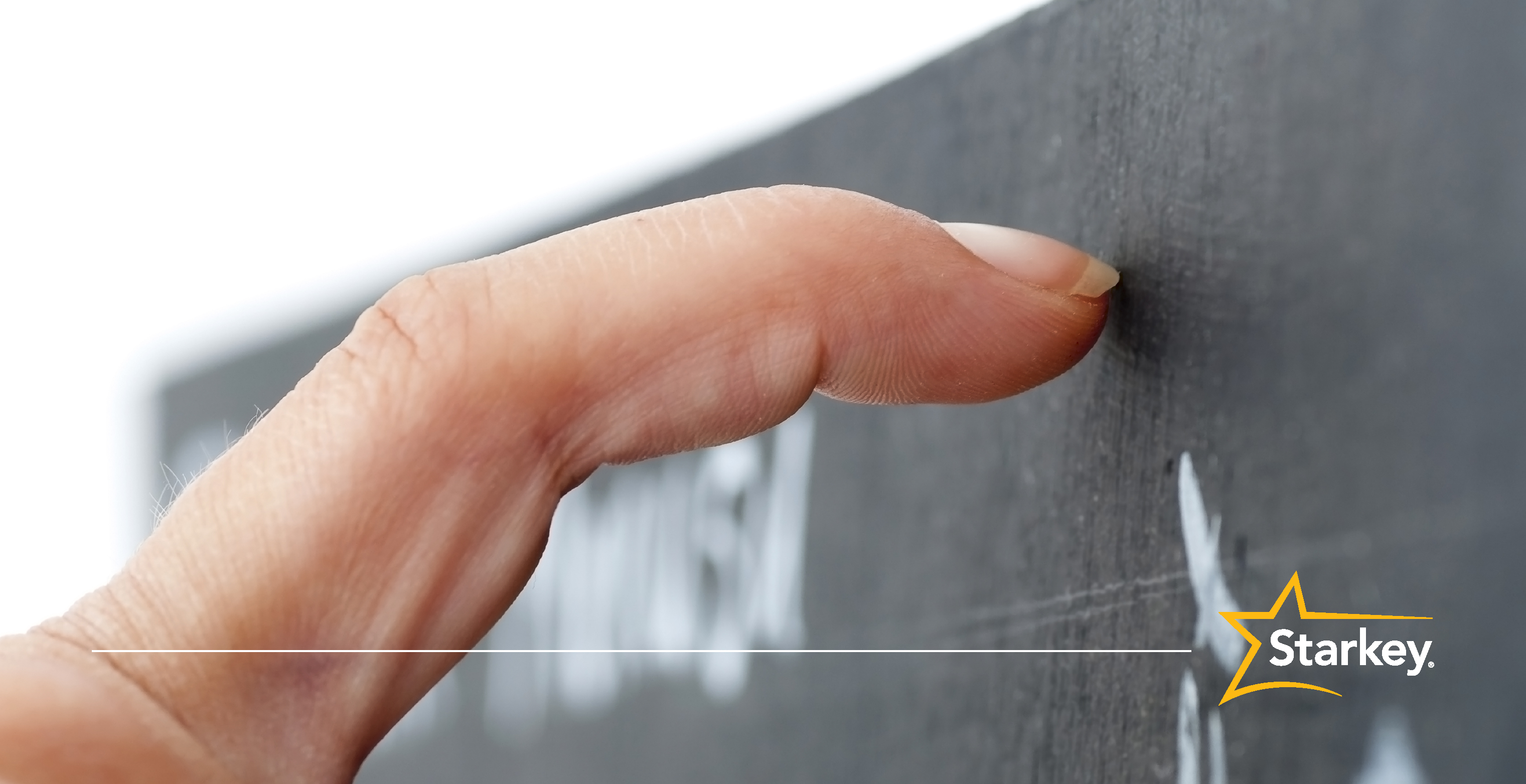 Close up of index finger nail scratching a chalkboard